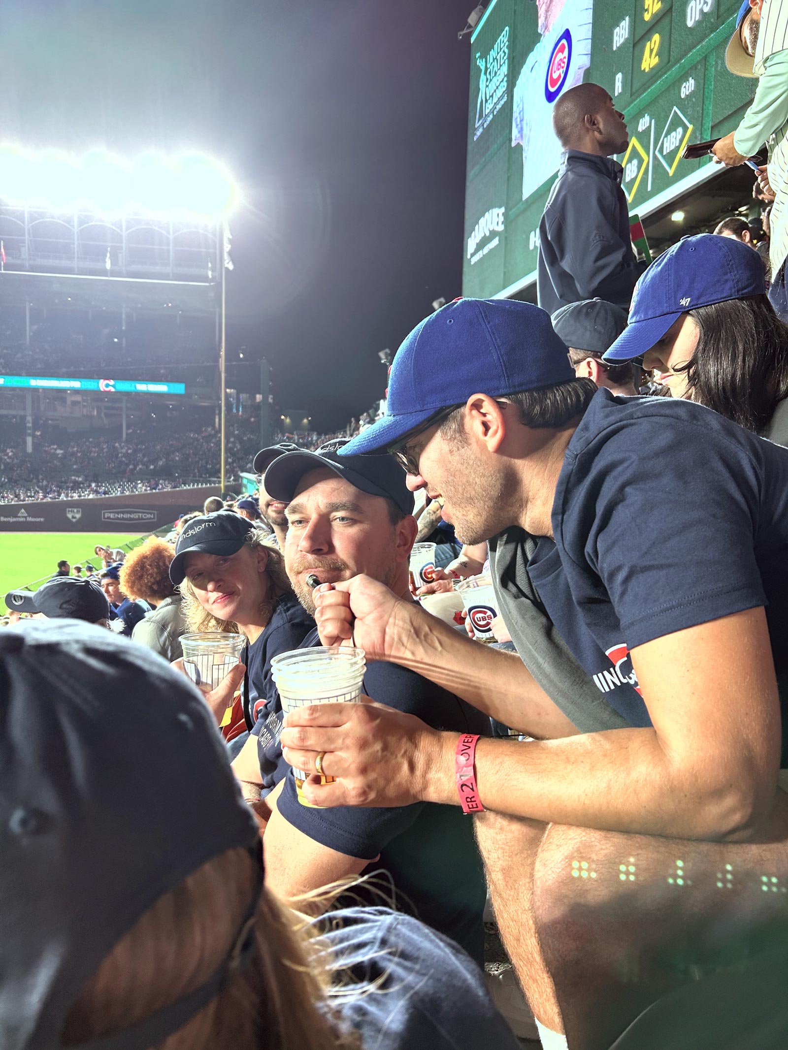Nathan interviewing Andy with a tiny mic during the Cubs game