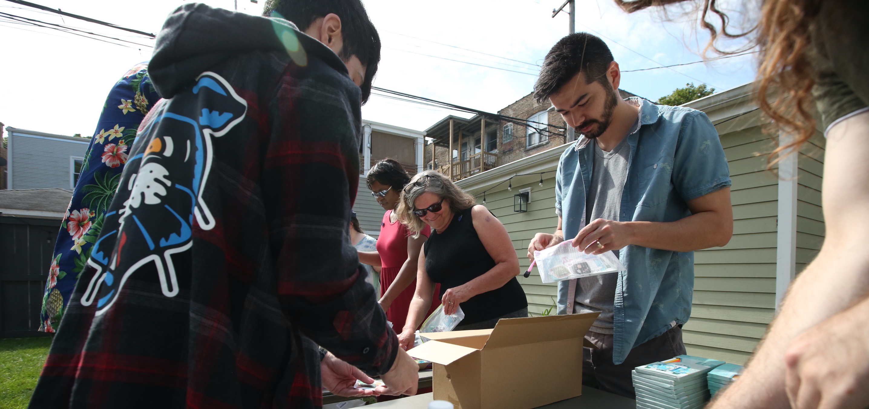 Several Sandstorm team members work together during a volunteer event.