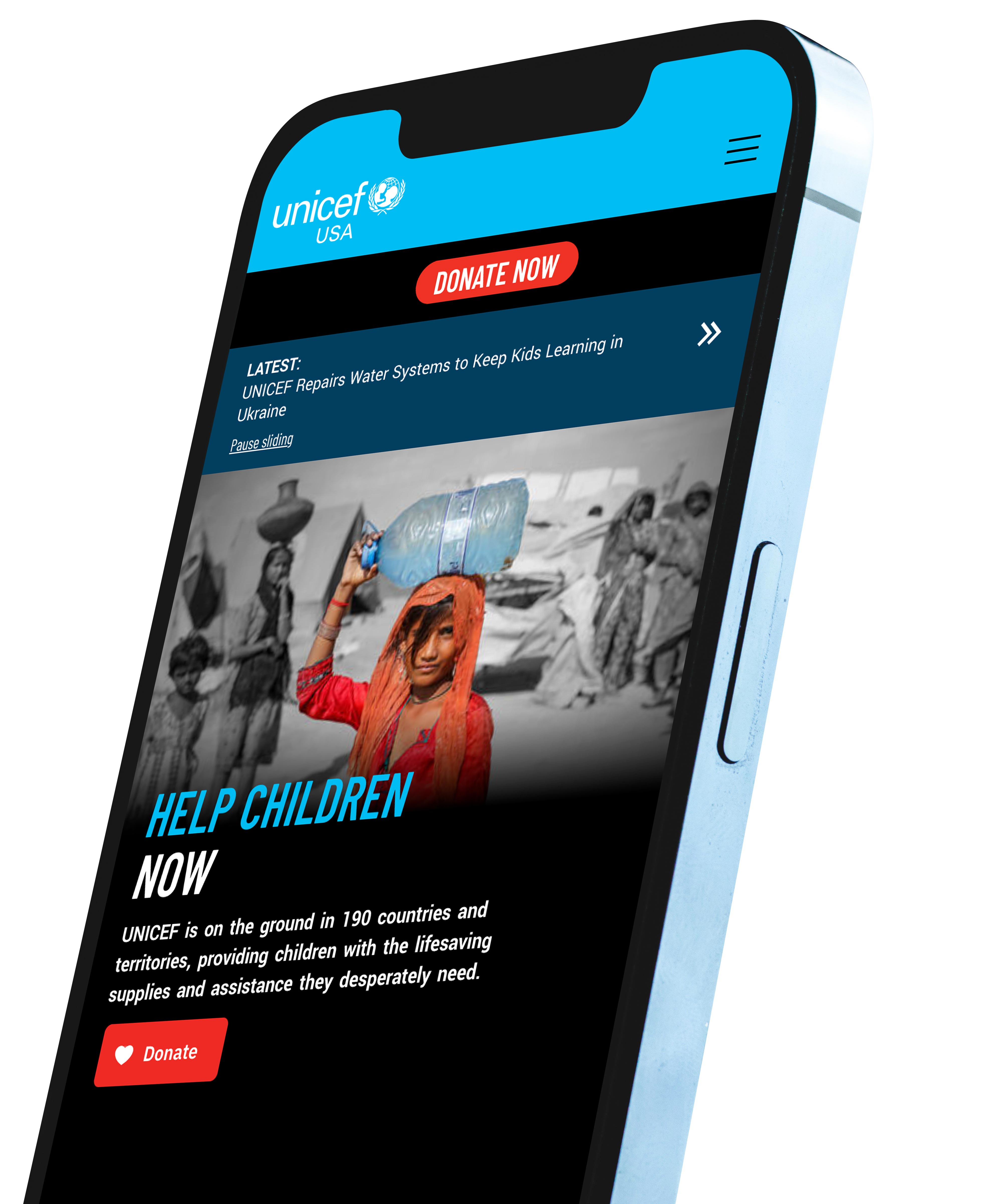 The UNICEF USA homepage on a mobile phone.