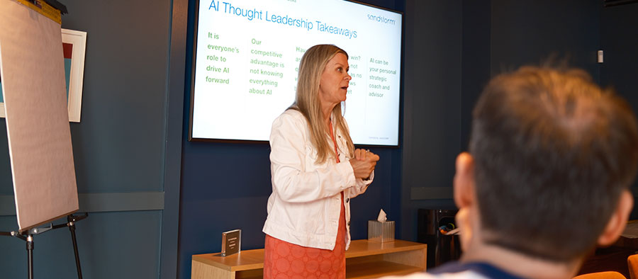 Sandy presenting AI Thought Leadership Takeaways to Sandstorm