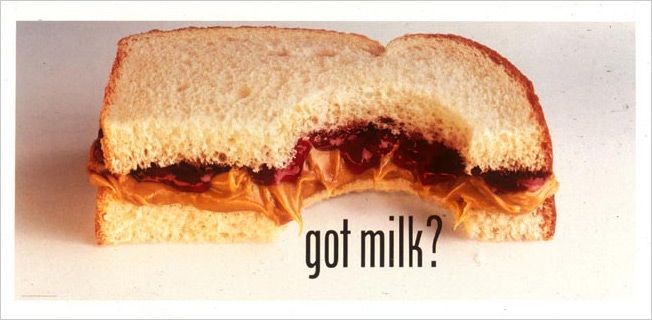 A "Got Milk?" ad featuring a peanut butter and jelly sandwich with a bite taken out of it.