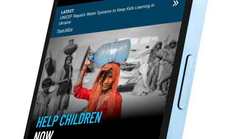 The UNICEF USA homepage on a mobile phone.