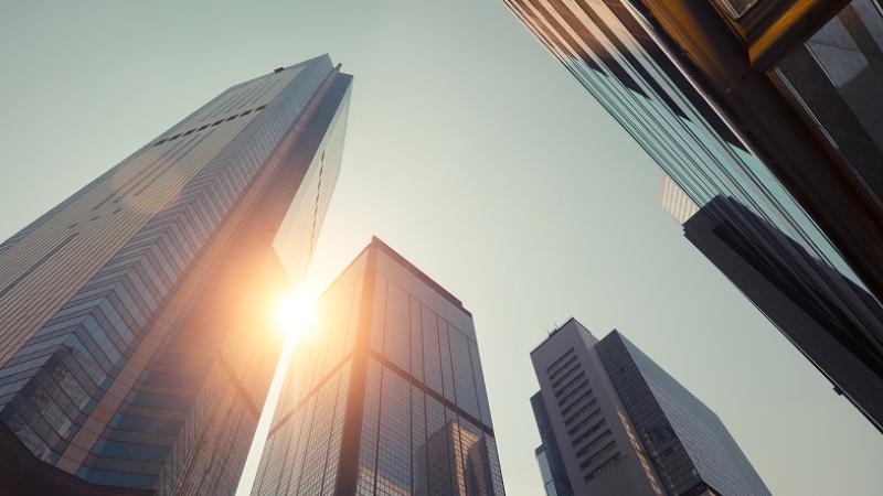 Cityscape view of four skyscrapers at sunset
