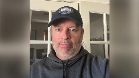 Cesar Perez a light skinned male with salt and pepper facial hair, wearing a grey sweatshirt and a Dallas Cowboys hat