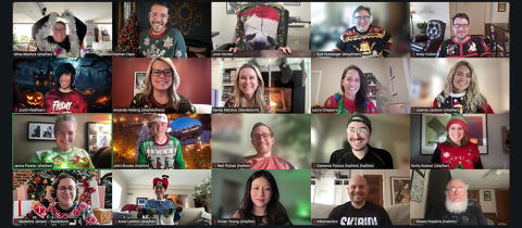 Sandstormers in their festive holiday sweaters smile at the camera